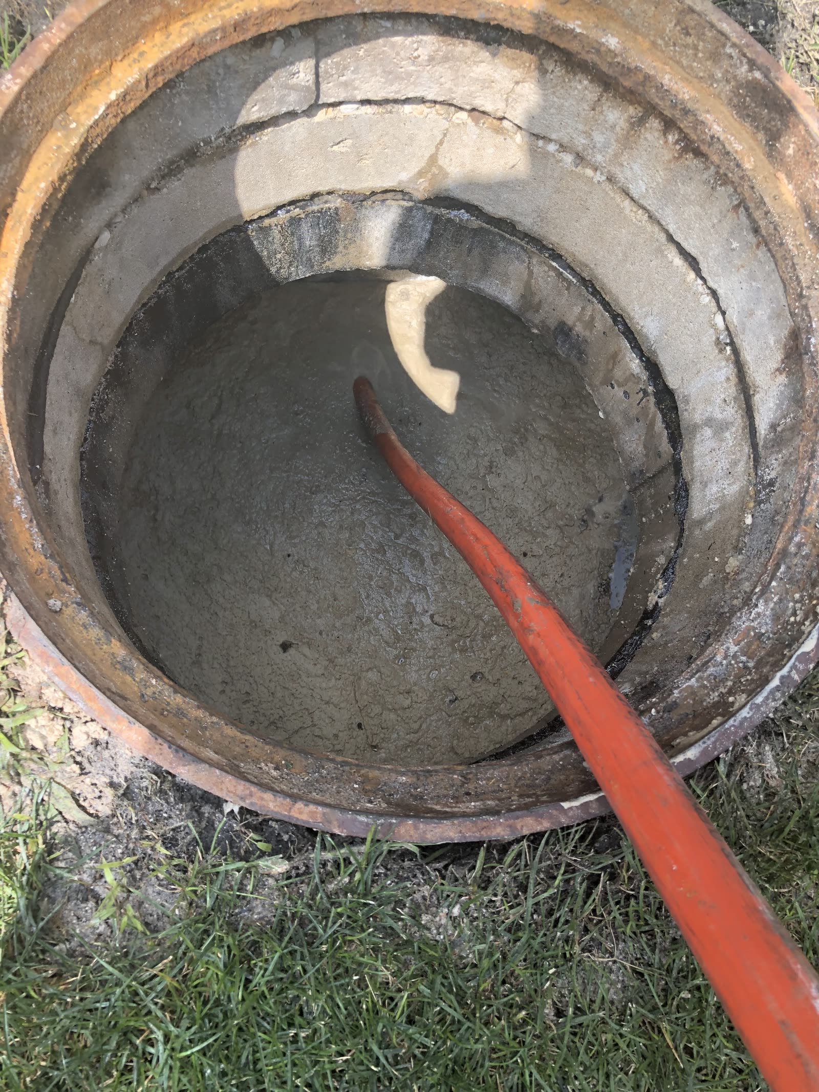 Manhole rodding in progress